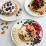 Three serving styles for protein pancakes with different toppings