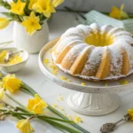 Homemade daffodil cake with yellow and white marbling on vintage cake stand
